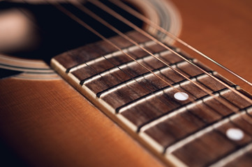 Fototapeta premium An acoustic guitar detail with dark vignette