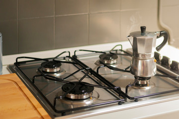 Steaming moka pot on the kitchen stove