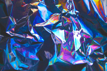 Holographic iridescent foil texture background. It can be used for posters, cards, flyers,...