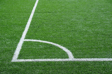 Obraz premium green football field with white marking lines