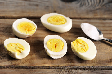 boiled eggs with salt on wooden rustic