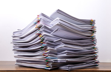 Stack of document paper with colorful paperclip