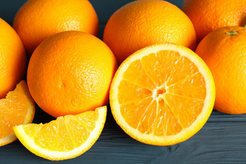Group of ripe oranges on wooden table, closeup