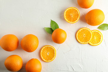Flat lay composition with ripe oranges on white background. Top view