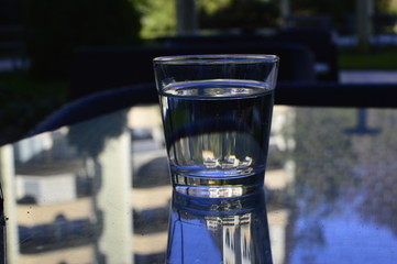 glass of water on table in cafe