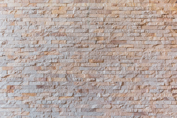 Background and texture stone cladding wall.