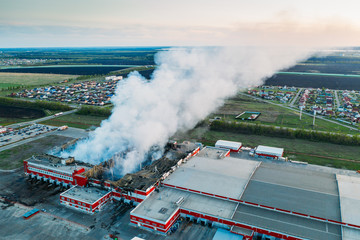 Smoke after fire in burnt distribution warehouse of network 