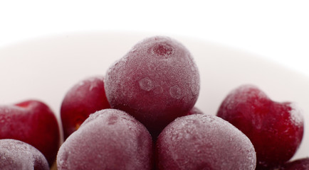 Group of frozen cherries.