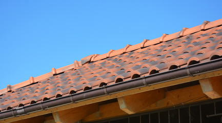 Clay rooftop with rain gutter pipeline