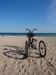Fototapeta premium unusual tricycle on the seashore