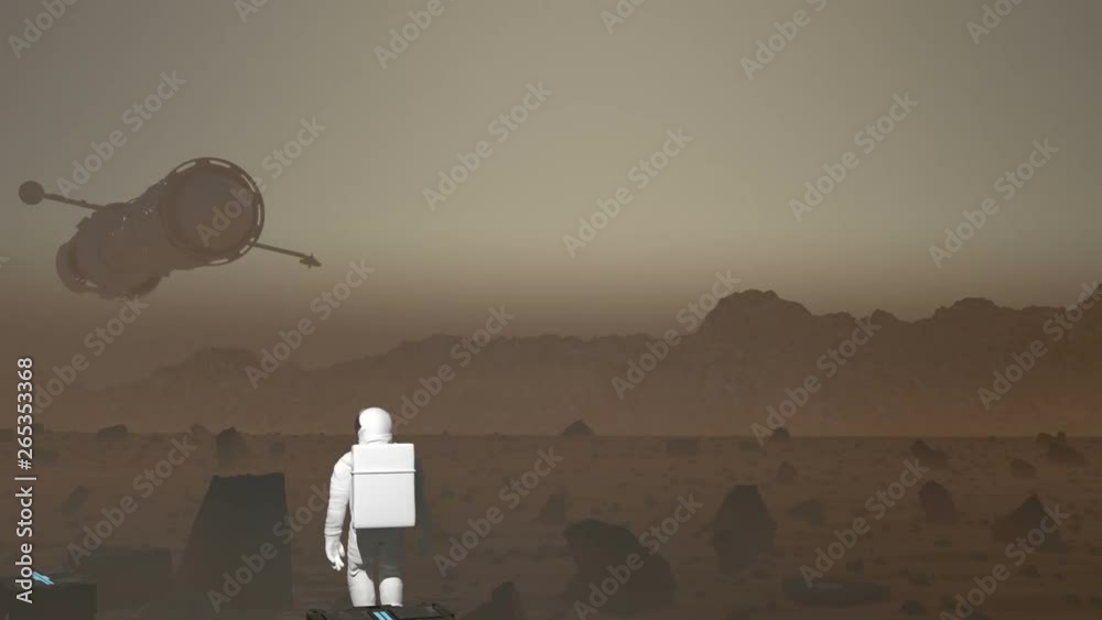 Wall mural astronaut in a space suit walks into the middle of frame on a mars like planet as a large futuristic