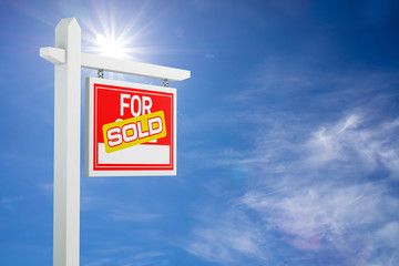 Sold For Sale Real Estate Sign over Clouds and Blue Sky. 3d Illustration