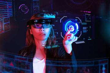 Business woman try vr glasses hololens in the dark room | Portrait of young asian girl experience ar communication | Future technology concept
