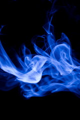 Blue smoke on black background