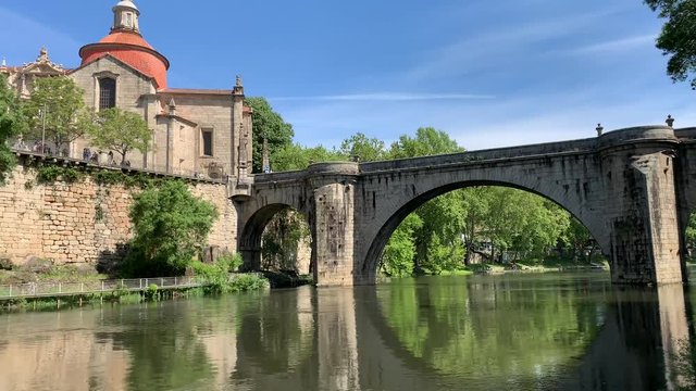 Beautiful view of the Sao Goncalo church and bridge on a clear spring day