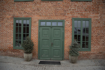Appearance of the entrance to the institution. Loft style door and windows. Brick wall