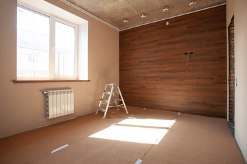 Empty room. Floor repair in private apartment. Moving to a new home. Interior renovation. Tile...
