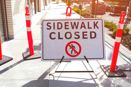 the image of sidewalk closed sign