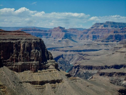A view from inside the Grand Canyon showing layers of rock and Colorado river