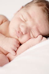 Newborn Baby Sleeping Peacefully on Soft Blanket