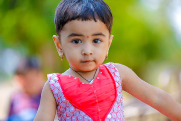 cute indian baby girl  playing in the park