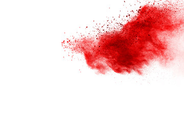 Freeze motion of red powder exploding, isolated on white background. Abstract design of red dust cloud. Particles explosion screen saver, wallpaper