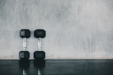 Dumbells on the floor in a gym top view