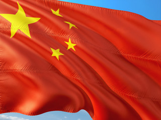 Flag of China waving in the wind against deep blue sky. High quality fabric.