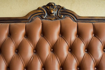 Old leather furniture with wooden inserts
