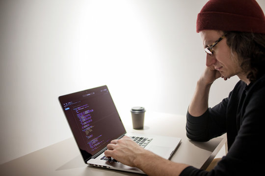 Programmer and coder working in the development environment. Programmer's workplace