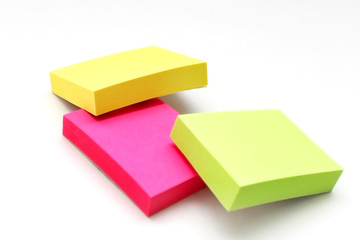 Fototapeta premium Three bright color packs of stickers on a white surface