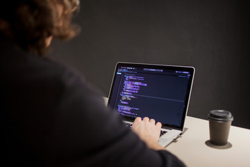 Programmer and coder working in the development environment. Programmer's workplace
