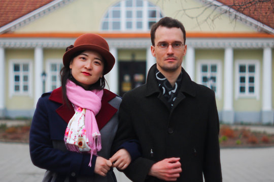 Old fashioned couple at an old house with columns