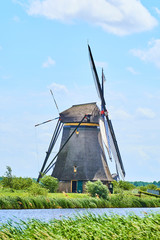 Netherlands rural lanscape with windmills at famous tourist site Kinderdijk in Holland. Old Dutch village Kinderdijk, UNESCO world heritage site. 