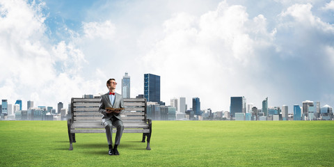 Young businessman or student studying the science and cityscape at background