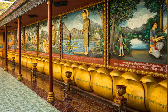 Colourful Artwork Lining An Ornate Wall; Krong Siem Reap, Siem Reap Province, Cambodia
