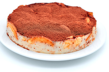 Chocolate cream pastry, isolate backgroun.. Chocolate cookie cake on isolated white background. Pie sprinkled with cocoa powder on a plate.