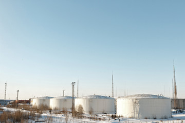 Vertical steel tanks. White.