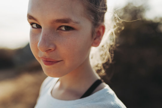 Close-up portrait of a preteen girl with freckles; Los Angeles, California, United States of America