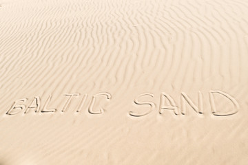 Fototapeta na wymiar inscription on the sand: baltic sand
