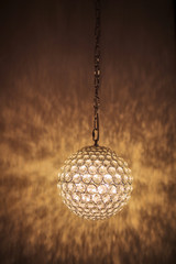 Obraz premium Pendant light lamp illuminated, Elegant Chandelier illuminated. round lamp in the interior.