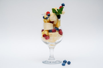 glass of fruit salad isolated on white background