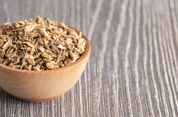 Echinacea Root in a Wooden Bowl on a Gray Wood Table