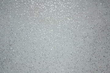 Abstraction of small crystal stars and spangles on a white background in the morning.