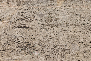 Natural marble background, natural natural texture of an ancient stone. It is used for finishing buildings and embankments, a fine background for a desktop and for photodesign