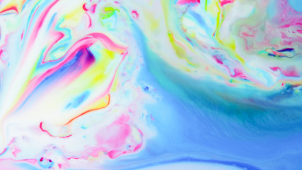 Obraz na płótnie Canvas Fluid art. Multicolored abstract background on the liquid. Color pattern in the style of pop art. Multicolored fluid stains. Widescreen