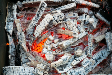 Hot burning coals in the grill. BBQ cooking picnic