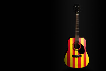Acoustic concert guitar with a drawn flag Catalonia, on a dark background, as a symbol of national...