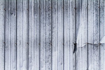 Steel wall texture with dent on the side; weathered steel wall with grunge like markings