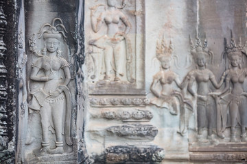 Fototapeta na wymiar Bas relief sculptures in the amazing Angkor Wat temple, Siem Reap, Cambodia